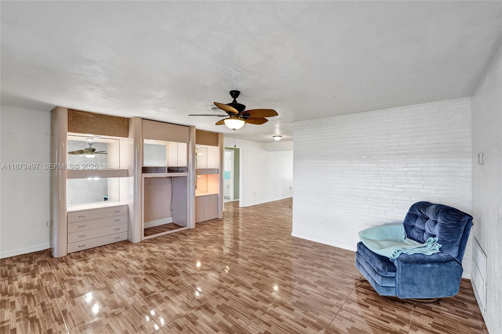3330 Taft Street Hollywood, FL 33021 - Photo 21 of 70 a living room with furniture and a fireplace
