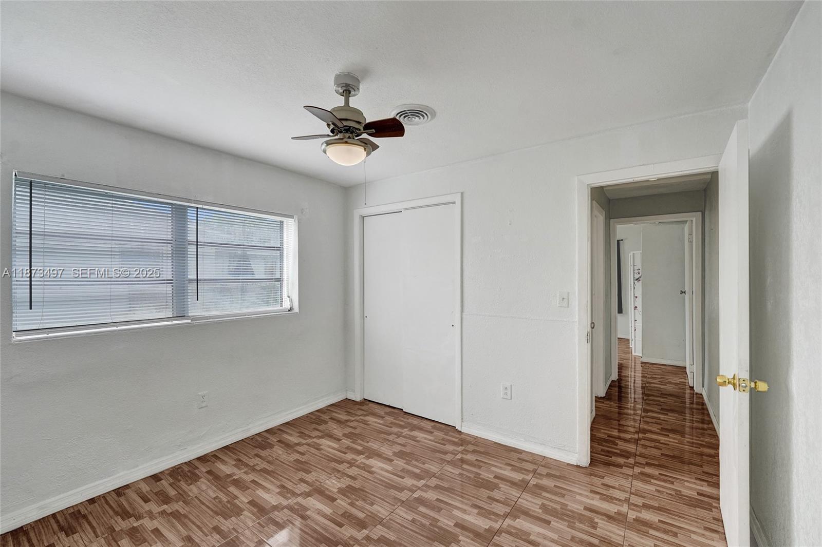 3330 Taft Street Hollywood, FL 33021 - Photo 40 of 70 a view of empty room with wooden floor and fan
