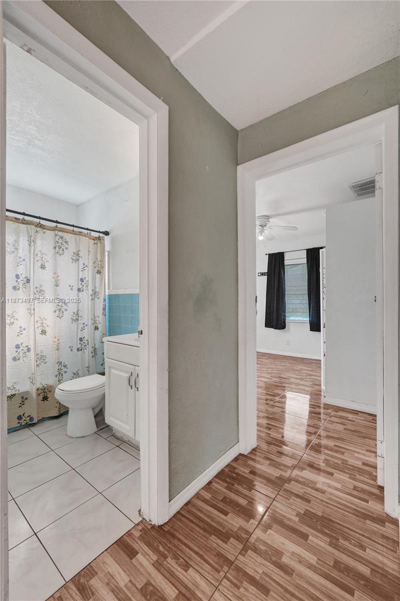 3330 Taft Street Hollywood, FL 33021 - Photo 43 of 70 a bathroom with a sink and a toilet