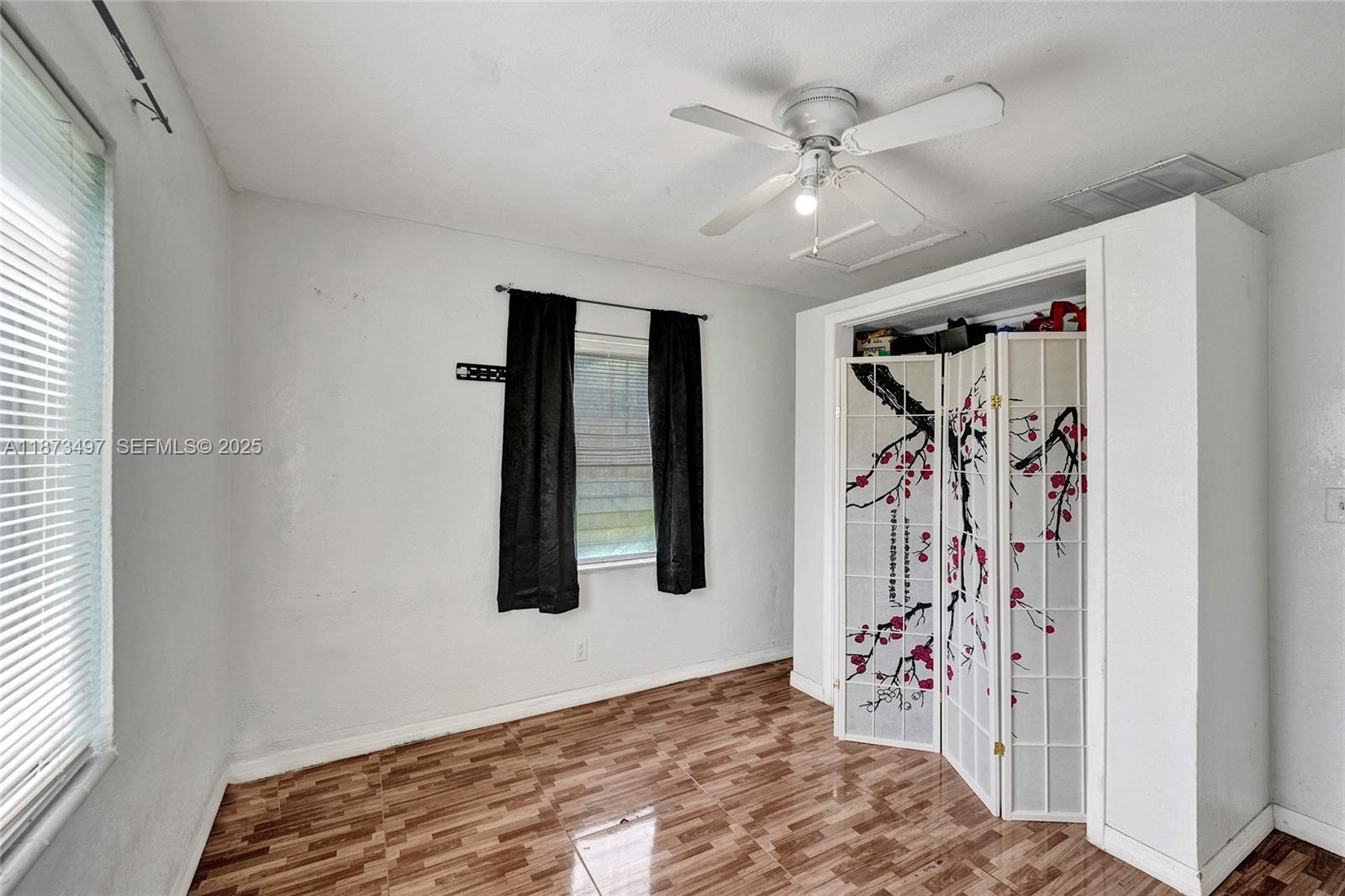 3330 Taft Street Hollywood, FL 33021 - Photo 47 of 70 a view of a livingroom with a ceiling fan and window