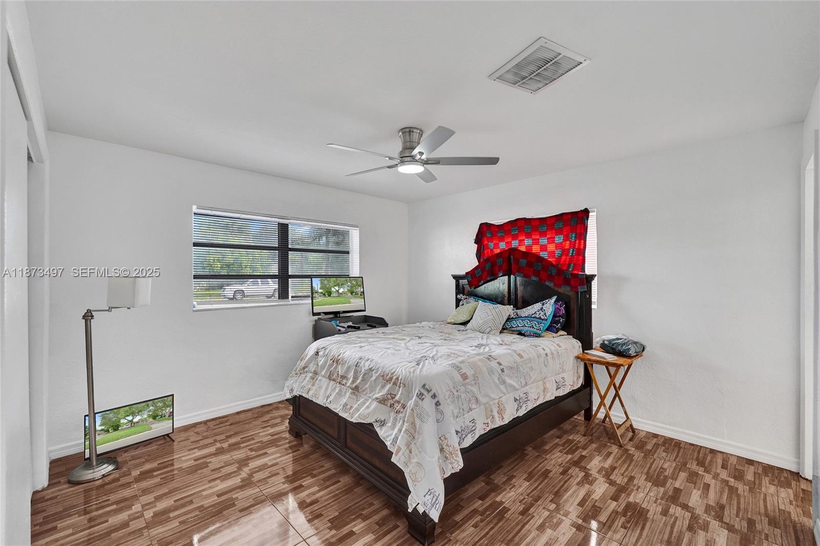 3330 Taft Street Hollywood, FL 33021 - Photo 49 of 70 a bedroom with bed and a window