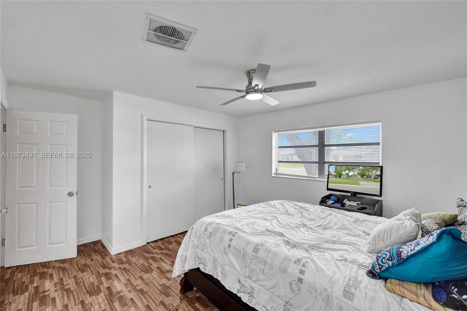 3330 Taft Street Hollywood, FL 33021 - Photo 52 of 70 a bedroom with a bed and a window