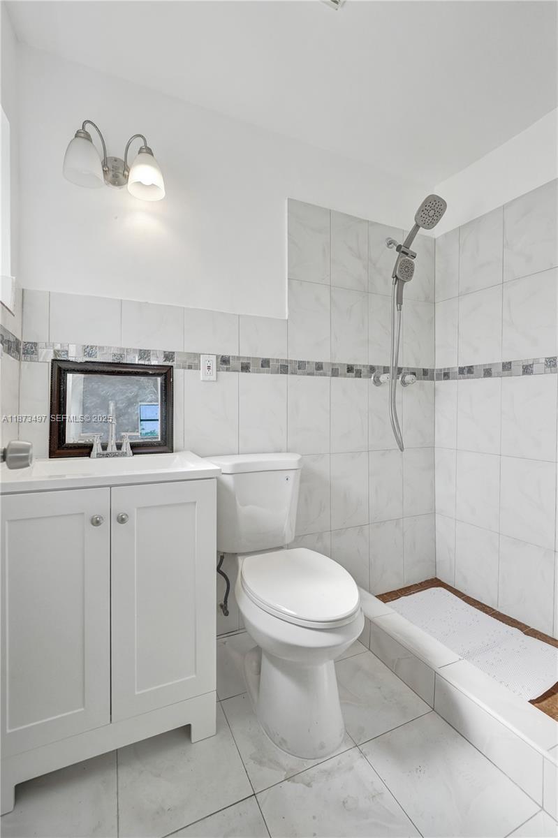 3330 Taft Street Hollywood, FL 33021 - Photo 54 of 70 a bathroom with a toilet sink and shower