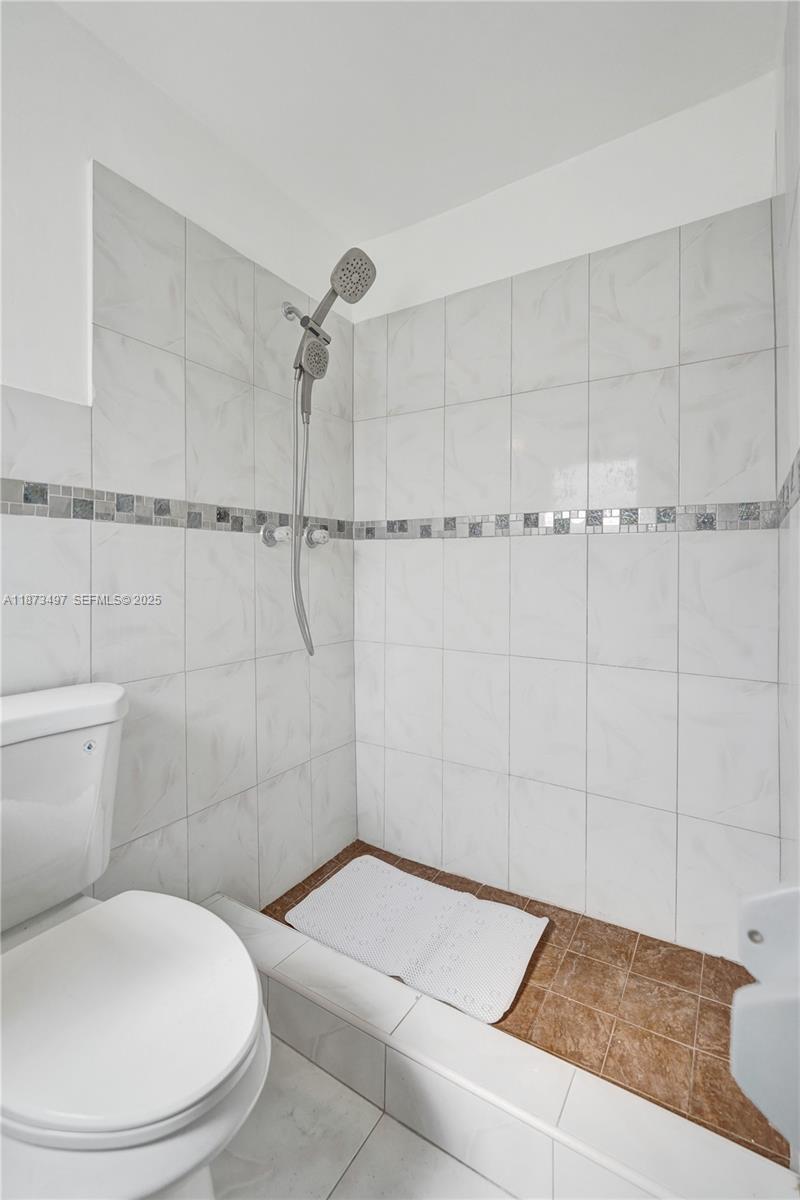 3330 Taft Street Hollywood, FL 33021 - Photo 55 of 70 a bathroom with a toilet and a shower