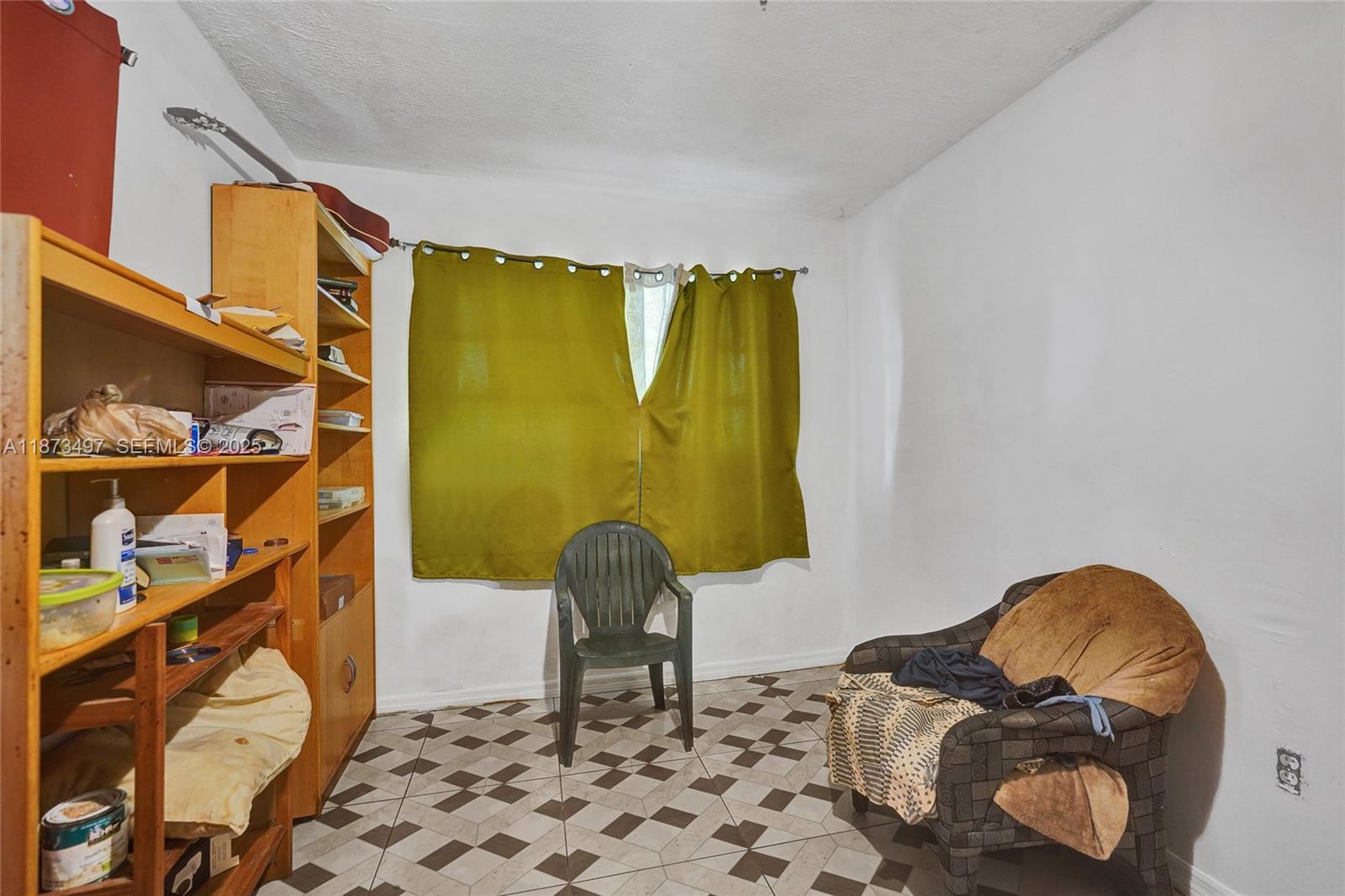 3330 Taft Street Hollywood, FL 33021 - Photo 57 of 70 a living room with a couch and a table