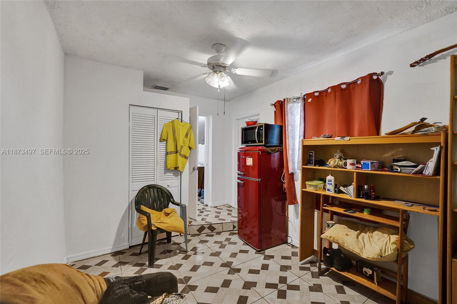 3330 Taft Street Hollywood, FL 33021 - Photo 58 of 70 a living room with furniture a rug and a window