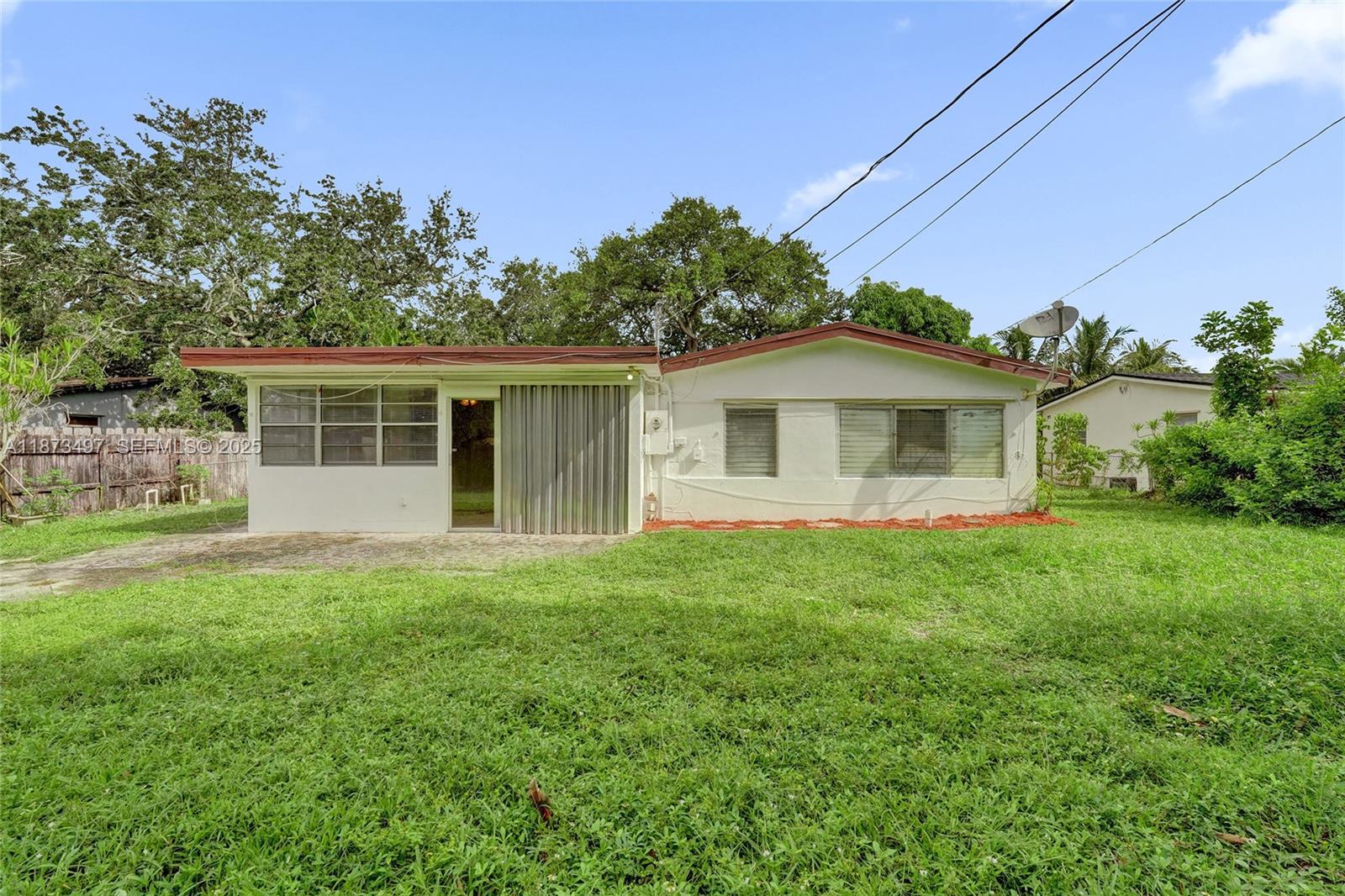 3330 Taft Street Hollywood, FL 33021 - Photo 64 of 70 a view of a house with a backyard