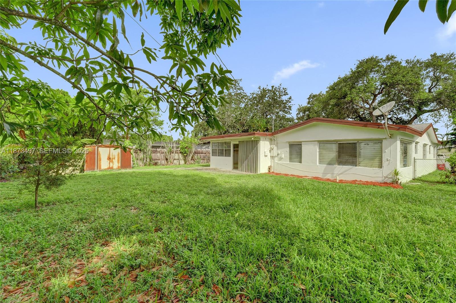 3330 Taft Street Hollywood, FL 33021 - Photo 65 of 70 a front view of a house with a garden