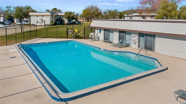 a view of a pool with a patio