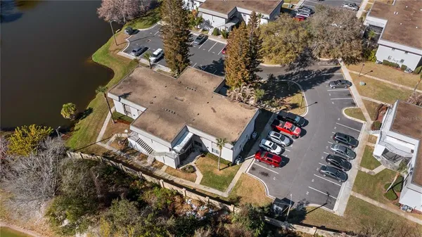 an aerial view of a house with a yard and garage