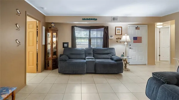 a living room with furniture and a window