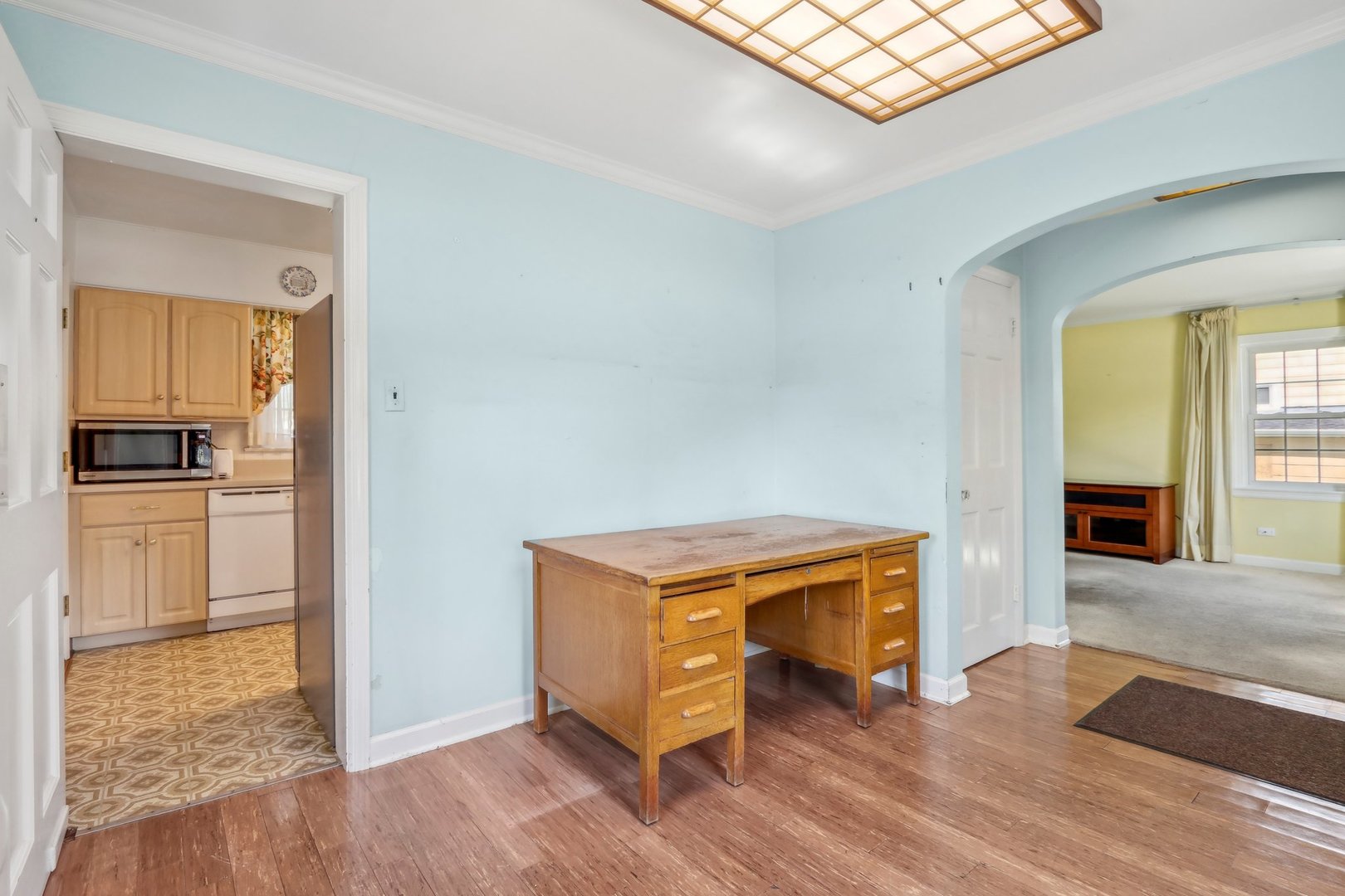 10 North Elmhurst Road Prospect Heights, IL 60070 - Photo 13 of 50 a kitchen with wooden floors and refrigerator