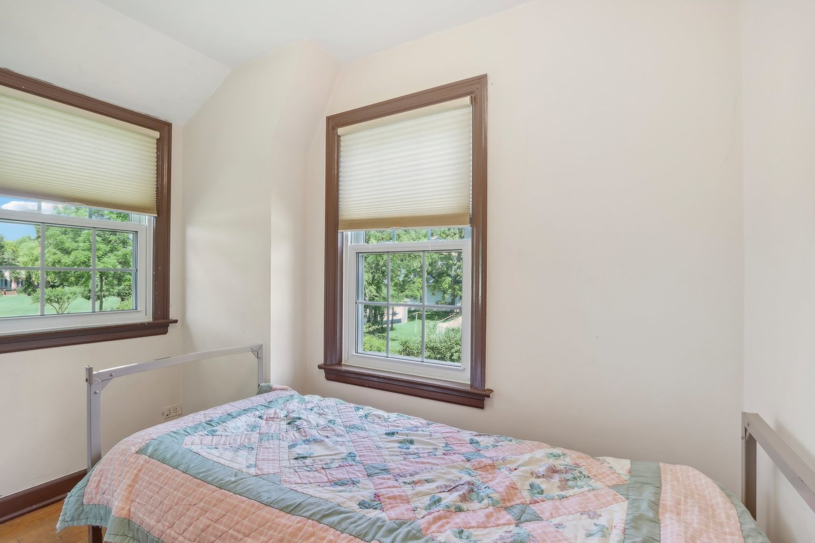 10 North Elmhurst Road Prospect Heights, IL 60070 - Photo 20 of 50 a bedroom with a bed and a window