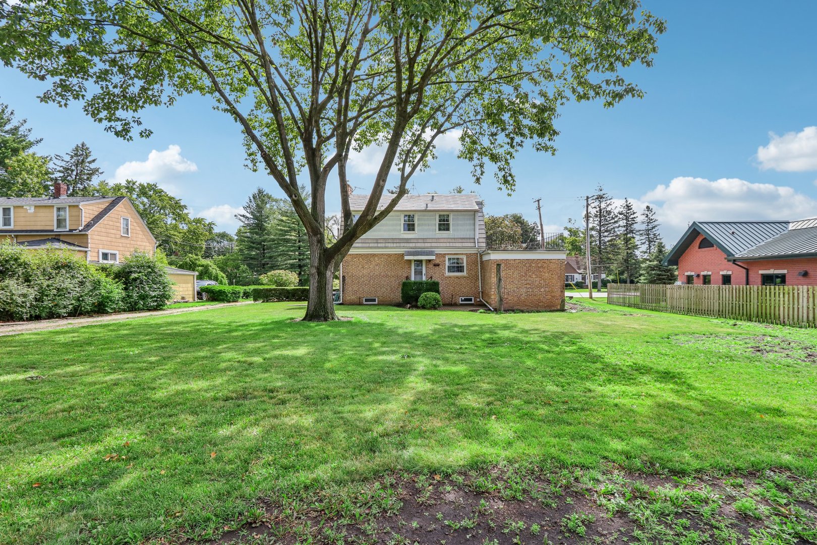 10 North Elmhurst Road Prospect Heights, IL 60070 - Photo 26 of 50 a front view of house with yard and trees in the background