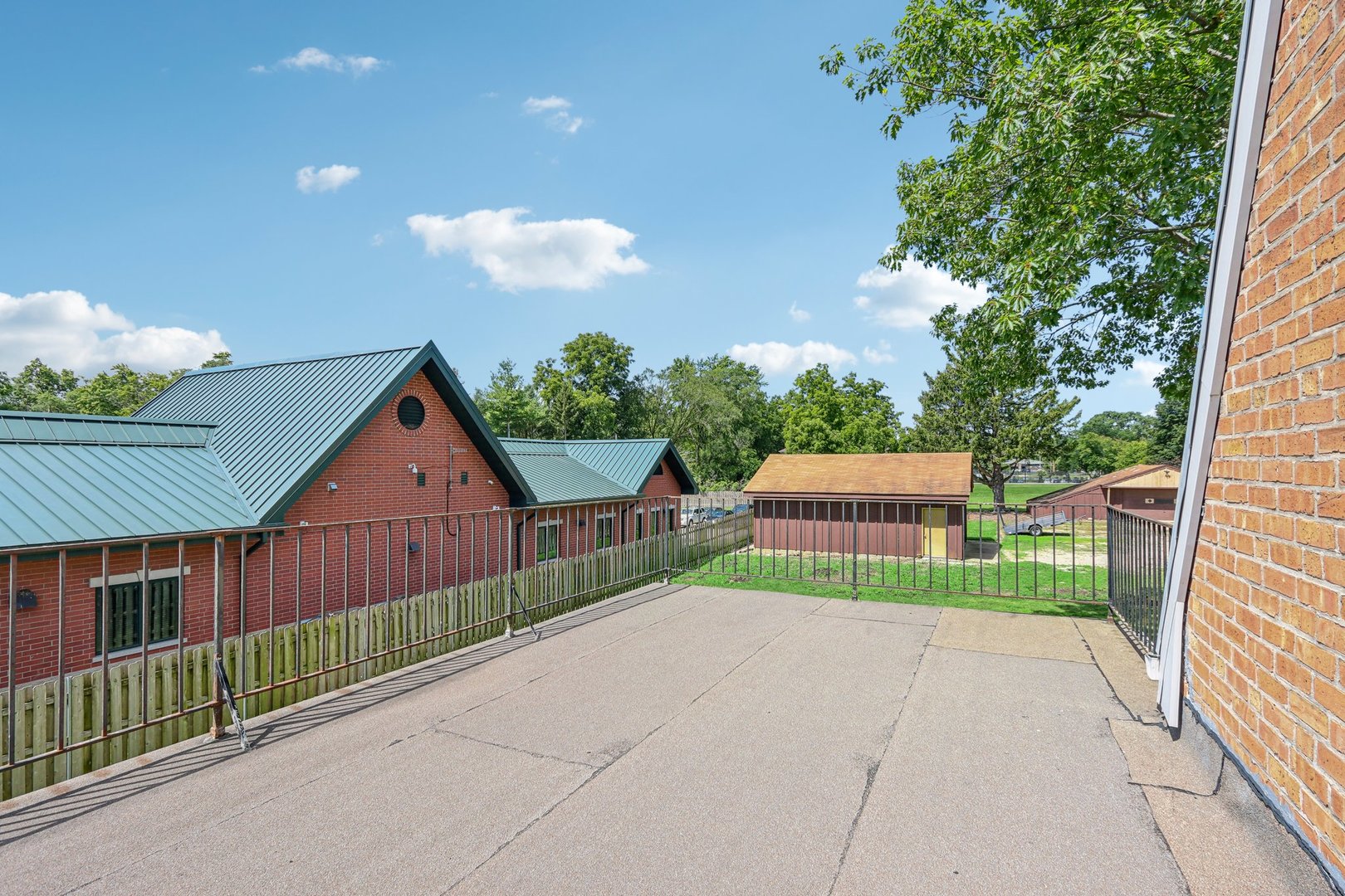 10 North Elmhurst Road Prospect Heights, IL 60070 - Photo 40 of 50 a view of a house with a small yard and a large tree
