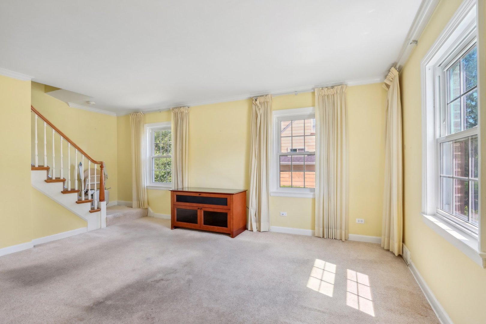 10 North Elmhurst Road Prospect Heights, IL 60070 - Photo 6 of 50 a view of livingroom with furniture staircase and windows
