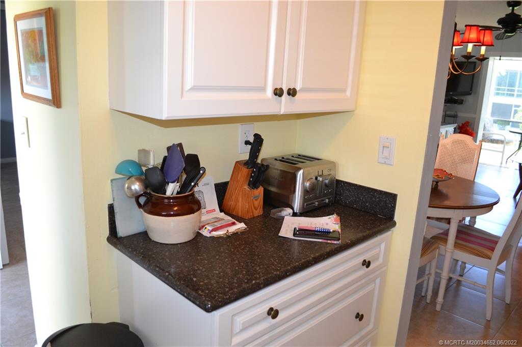 1969 Southwest Palm City Road, Unit G Stuart, FL 34994 - Photo 11 of 76 a kitchen with a stove and cabinets