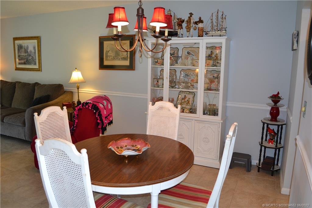 1969 Southwest Palm City Road, Unit G Stuart, FL 34994 - Photo 17 of 76 a view of a dining room with furniture