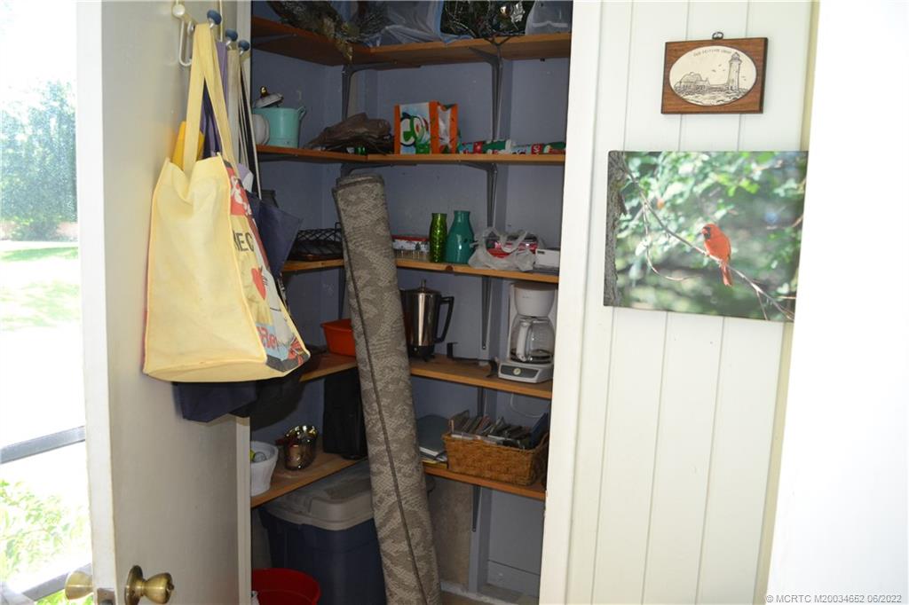 1969 Southwest Palm City Road, Unit G Stuart, FL 34994 - Photo 42 of 76 a room with storage and utility