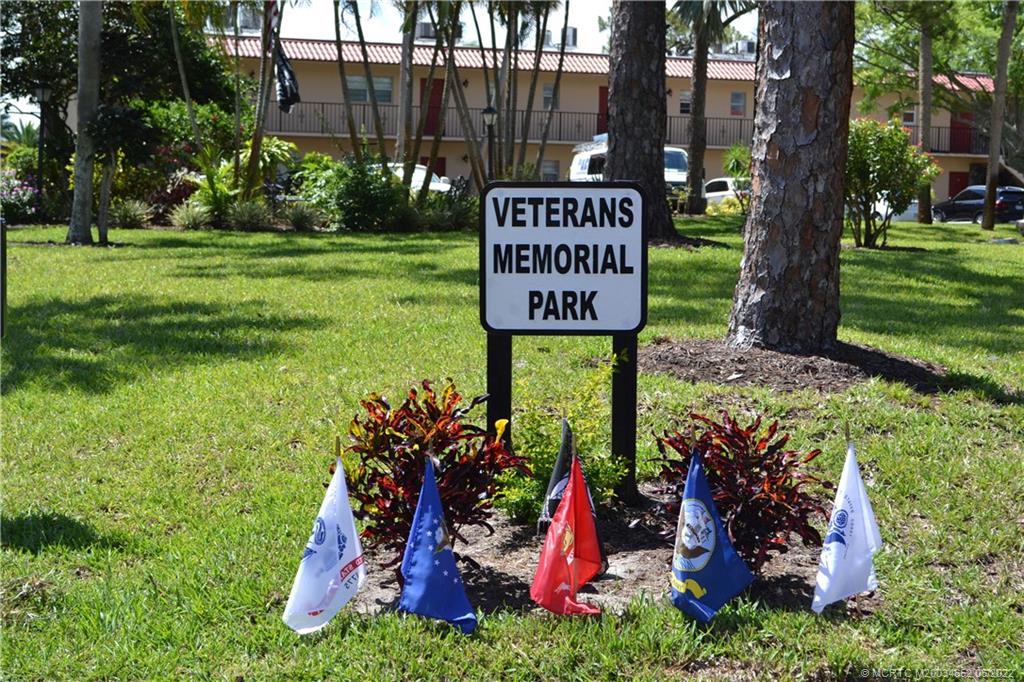 1969 Southwest Palm City Road, Unit G Stuart, FL 34994 - Photo 58 of 76 a view of sign board with a yard