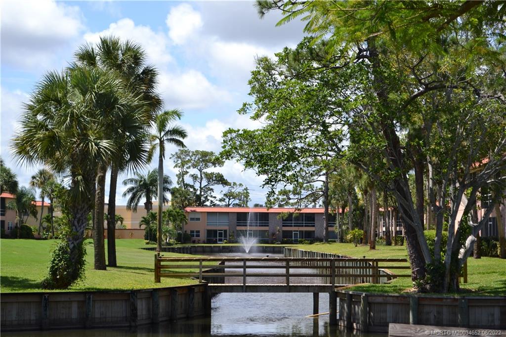 1969 Southwest Palm City Road, Unit G Stuart, FL 34994 - Photo 59 of 76 a view of a swimming pool with a patio