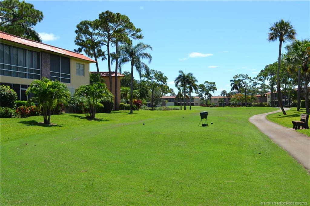 1969 Southwest Palm City Road, Unit G Stuart, FL 34994 - Photo 62 of 76 a view of a house with a backyard