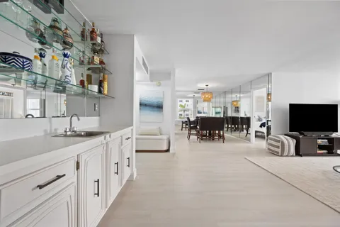 a view of a dining room with furniture and chandelier