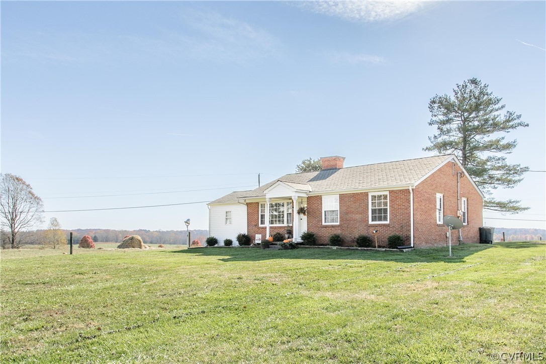 8968 South James River Road Buckingham, VA 23921 - Photo 25 of 35 a front view of a house with a garden and plants