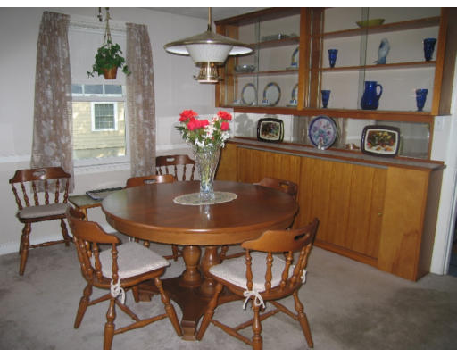 9 Leroy Road Lexington, MA 02421 - Photo 2 of 9 a dining room with furniture and a chandelier