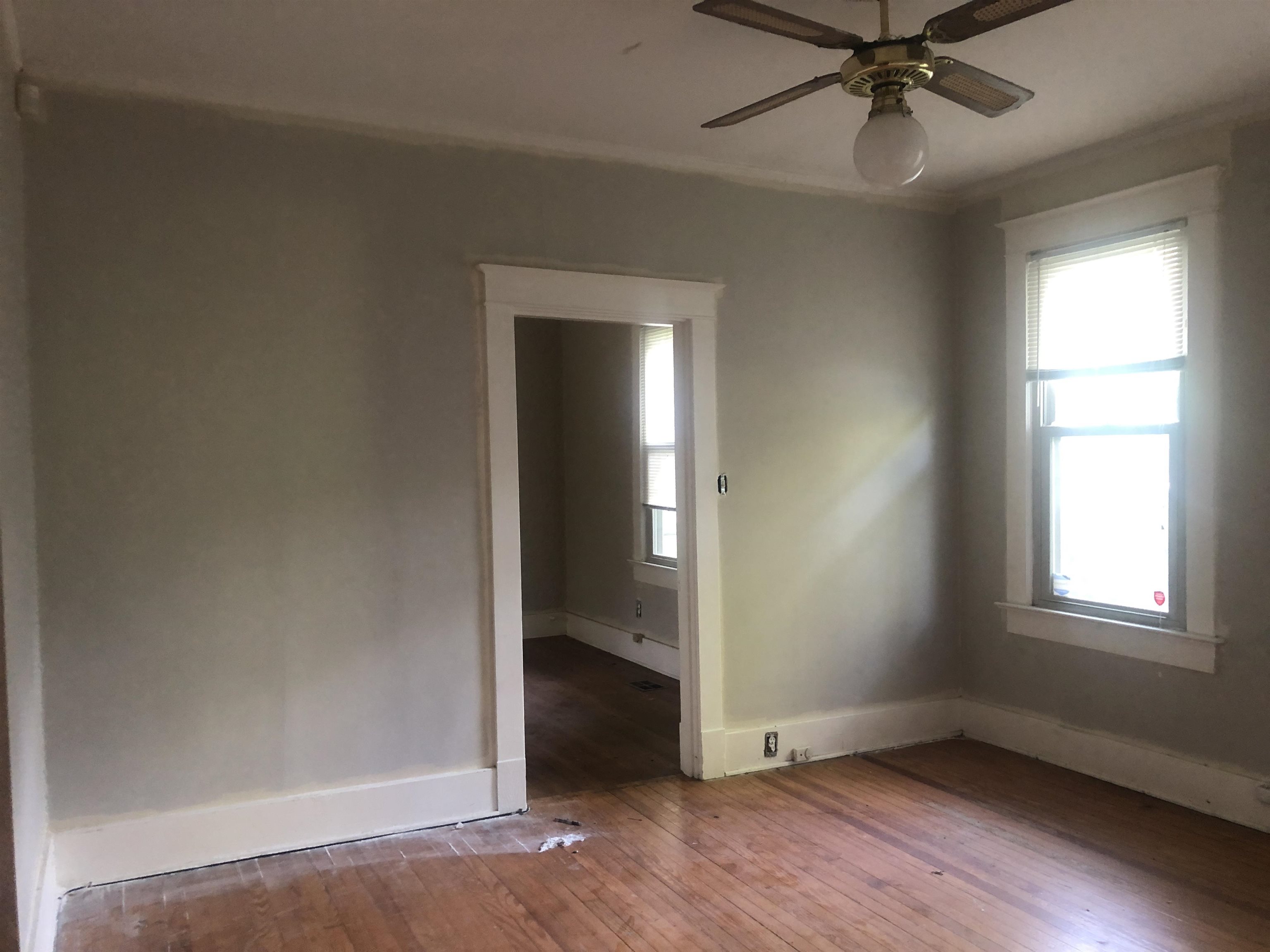3688 Graves Road Memphis, TN 38116 - Photo 13 of 23 an empty room with wooden floor closet and windows