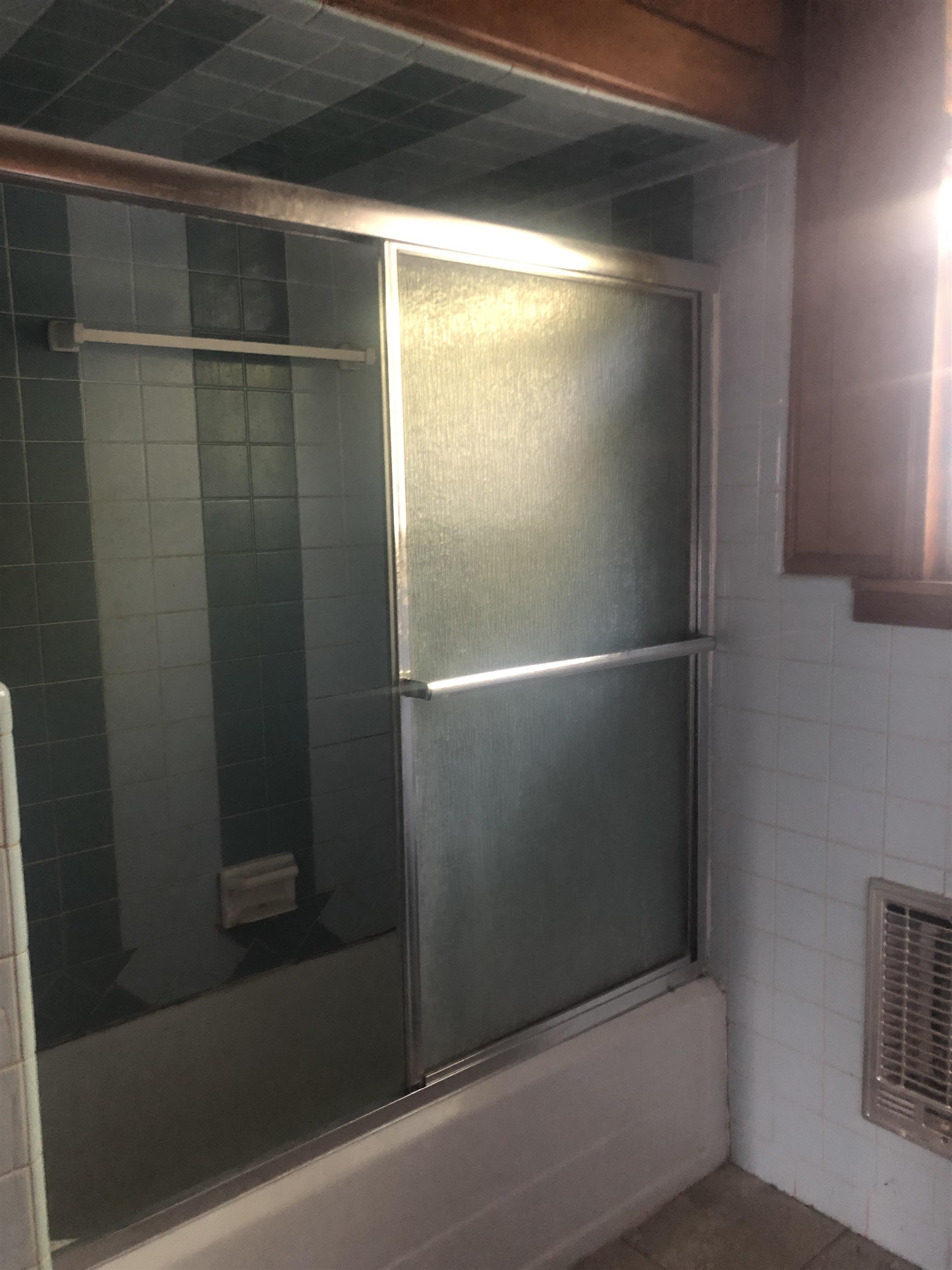 3688 Graves Road Memphis, TN 38116 - Photo 21 of 23 a bathroom with a glass shower door