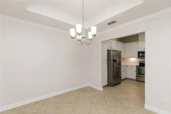 a view of a kitchen with a sink and stainless steel appliances