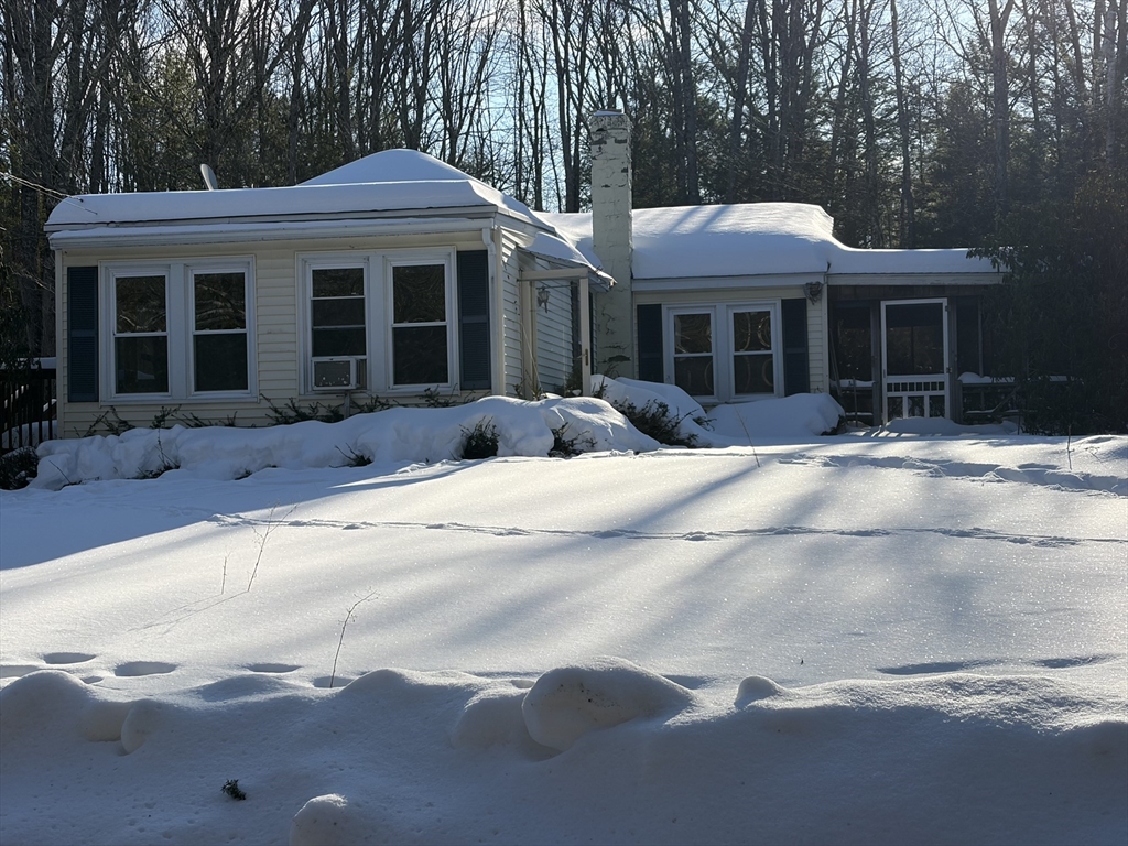 11 South Chesterfield Road Goshen, MA 01096 - Photo 1 of 26 a front view of a house with a yard