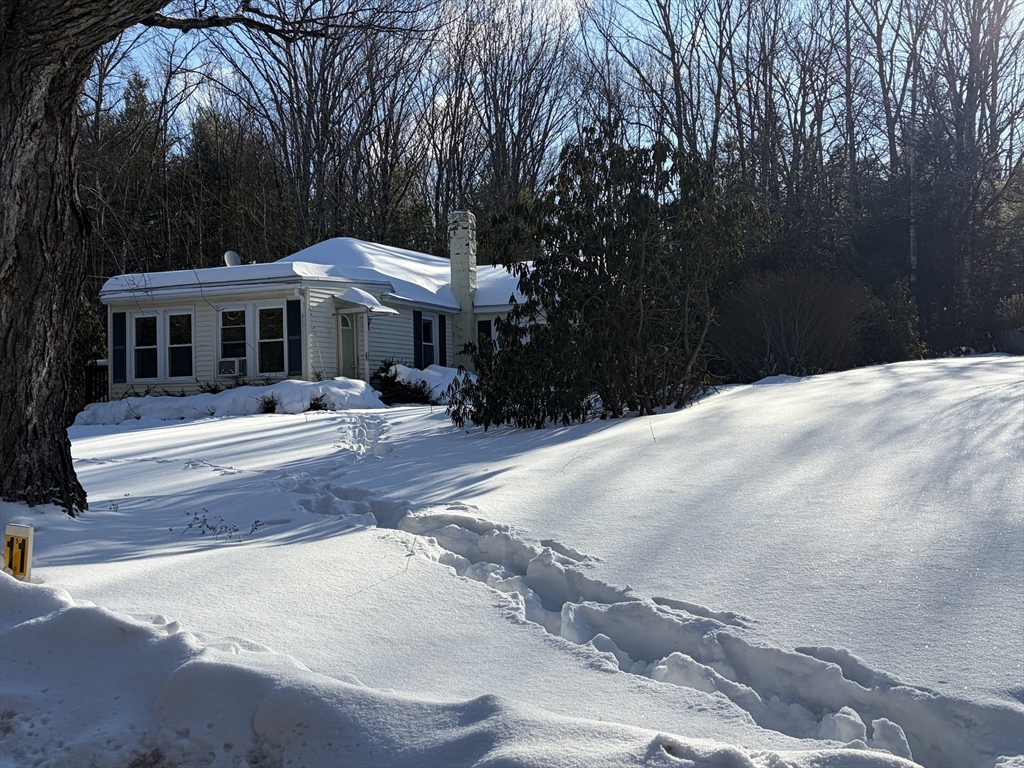 11 South Chesterfield Road Goshen, MA 01096 - Photo 2 of 26 a front view of a house with yard and trees