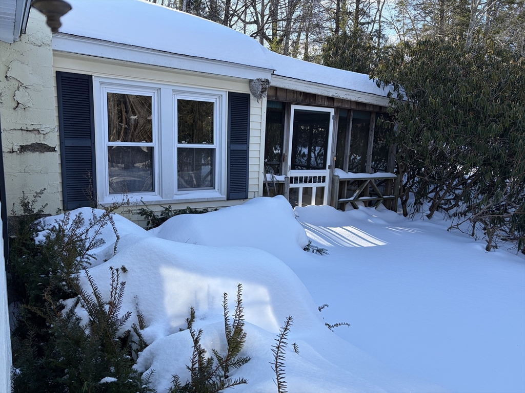 11 South Chesterfield Road Goshen, MA 01096 - Photo 3 of 26 a balcony with table and chairs and potted plants