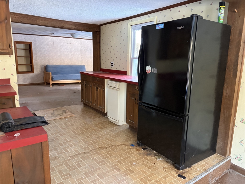 11 South Chesterfield Road Goshen, MA 01096 - Photo 7 of 26 a kitchen with a refrigerator and a stove