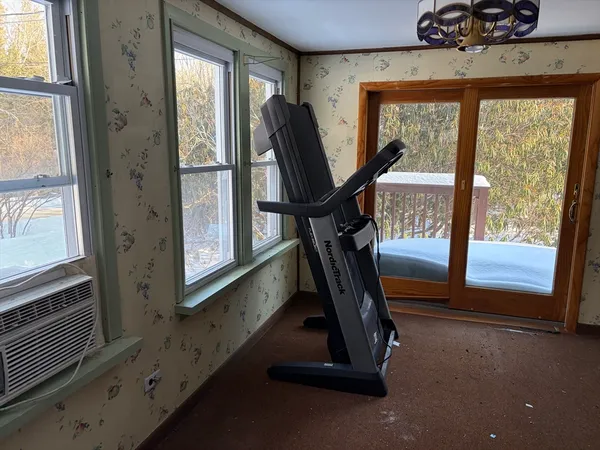 a view of gym equipment with windows