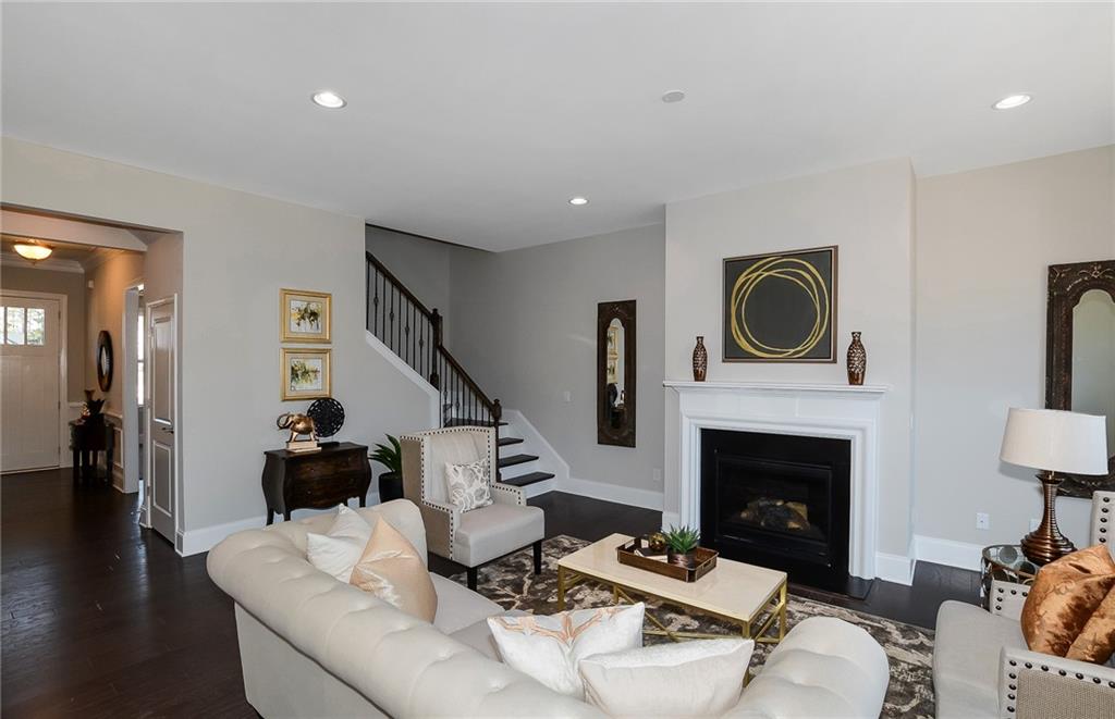 4316 Azalea Rdg Way Hoschton, GA 30548 - Photo 12 of 36 a living room with furniture and a fireplace