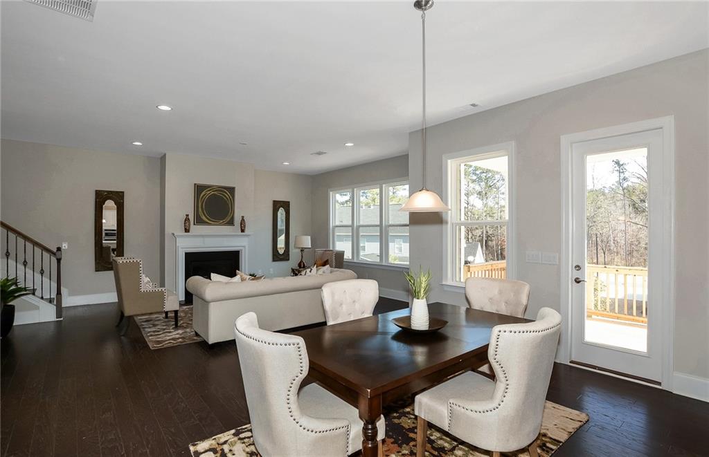 4316 Azalea Rdg Way Hoschton, GA 30548 - Photo 14 of 36 a living room with fireplace furniture and a large window