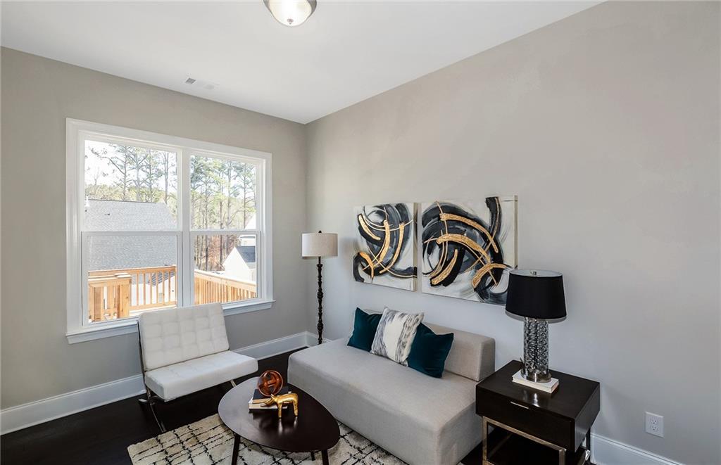 4316 Azalea Rdg Way Hoschton, GA 30548 - Photo 19 of 36 a living room with furniture and a window