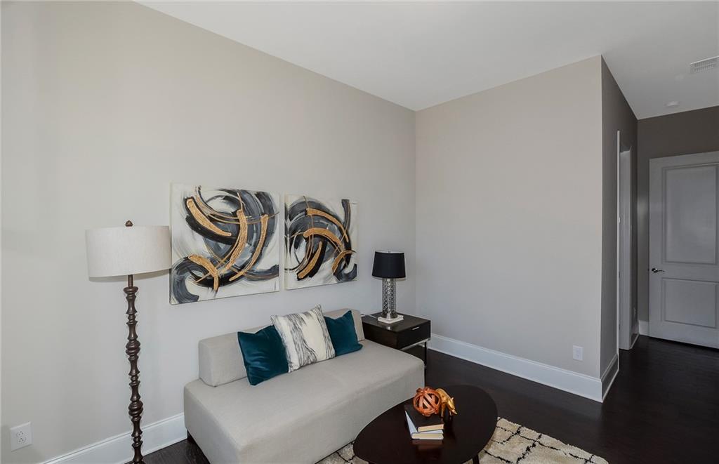 4316 Azalea Rdg Way Hoschton, GA 30548 - Photo 20 of 36 a living room with furniture and a rug