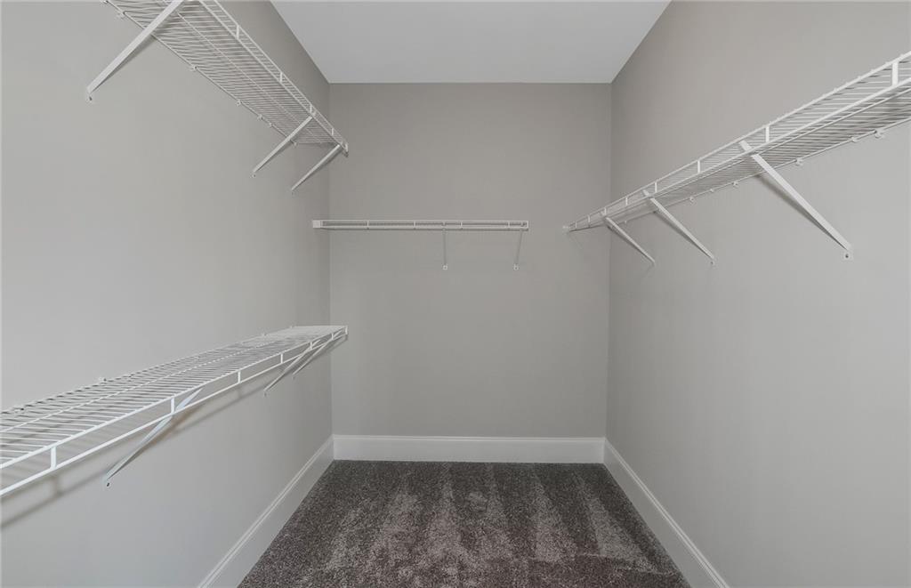 4316 Azalea Rdg Way Hoschton, GA 30548 - Photo 23 of 36 a view of a room with racks on the wall