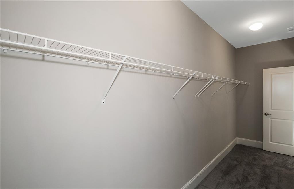 4316 Azalea Rdg Way Hoschton, GA 30548 - Photo 24 of 36 a view of a room with racks on the wall