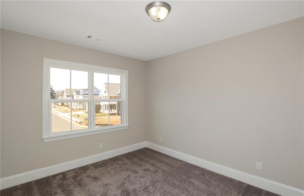 4316 Azalea Rdg Way Hoschton, GA 30548 - Photo 25 of 36 an empty room with a window
