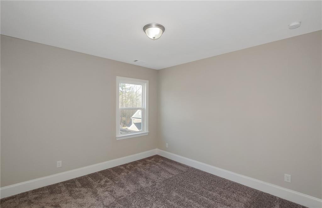 4316 Azalea Rdg Way Hoschton, GA 30548 - Photo 28 of 36 an empty room with windows