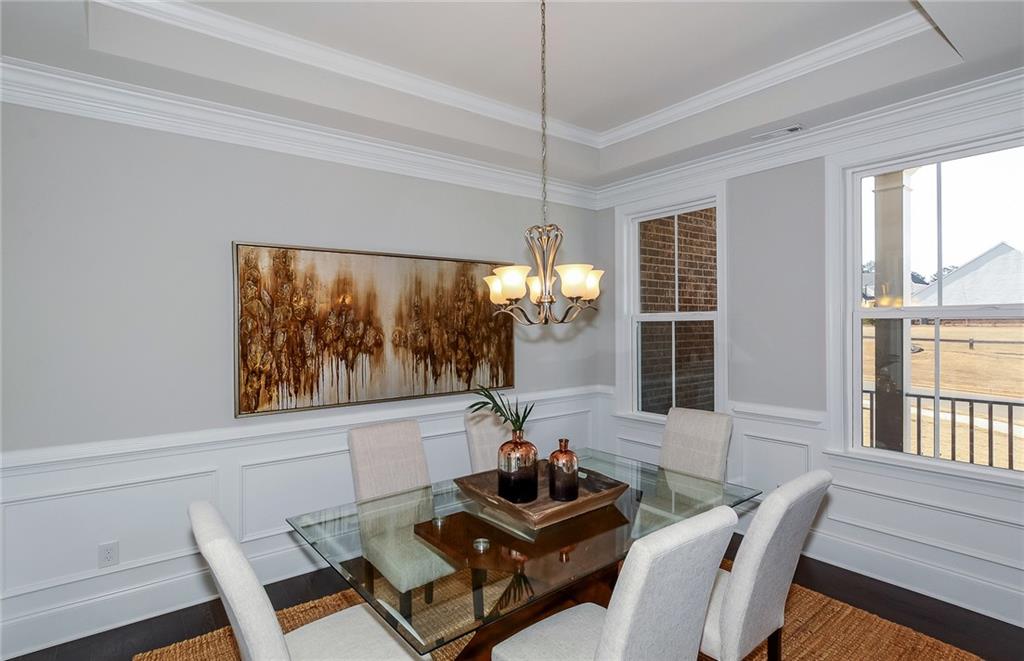 4316 Azalea Rdg Way Hoschton, GA 30548 - Photo 5 of 36 a living room with furniture and a floor to ceiling window