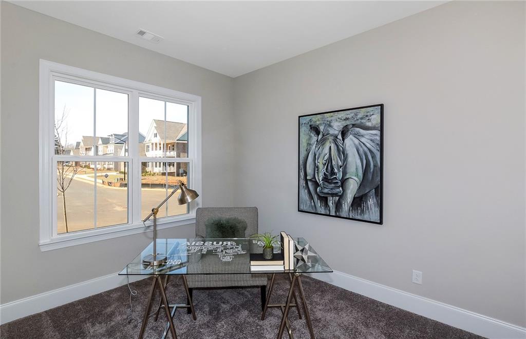 4316 Azalea Rdg Way Hoschton, GA 30548 - Photo 7 of 36 a living room with furniture and a window