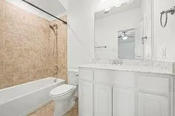 a bathroom with a sink a toilet and a bathtub