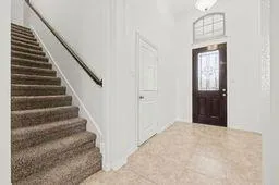 a view of an entryway with staircase