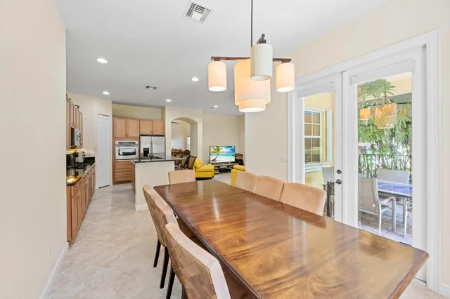 a bathroom with a tub a sink and mirror